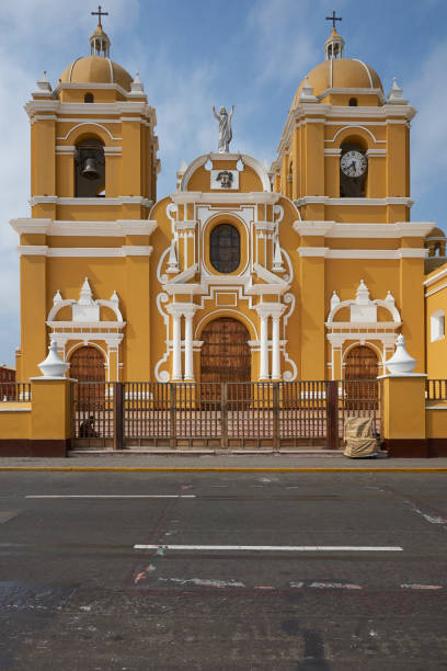 Yellow Cathedral Trujillo, Peru - September 1, 2014: Bright yellow colonial style Cathedral in the Plaza de Armas of Trujillo, Peru trujillo peru stock pictures, royalty-free photos & images