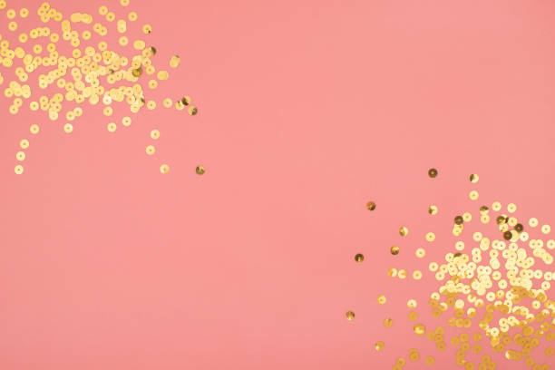 istock Pink pastel festive background with golden sparkling sequins. Abstract backdrop with confetti. 1209287891