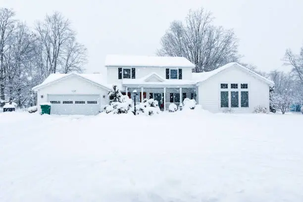 Photo of Suburban Colonial Home During Extreme Blizzard Snow Storm
