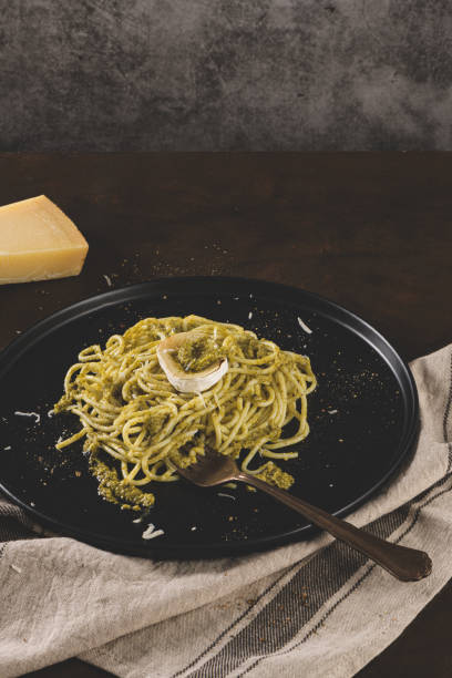 istock Fresh spaghetti with basil pesto and cheese 1209292379