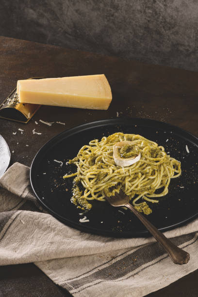istock Fresh spaghetti with basil pesto and cheese 1209292413