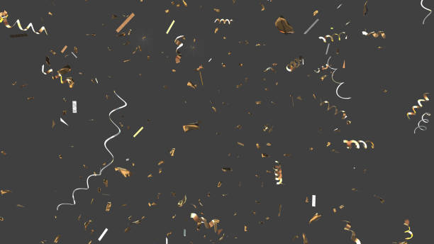 Golden and Silver confetti falling down. Clipping path is provided to extract the background. stock photo