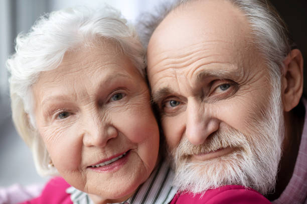 istock Close up picture of elderly grey-haired smiling couple 1209299521