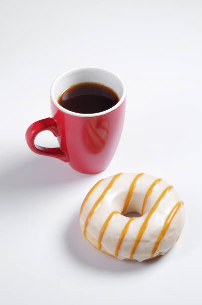 istock Donut and red cup of coffee 1209301067