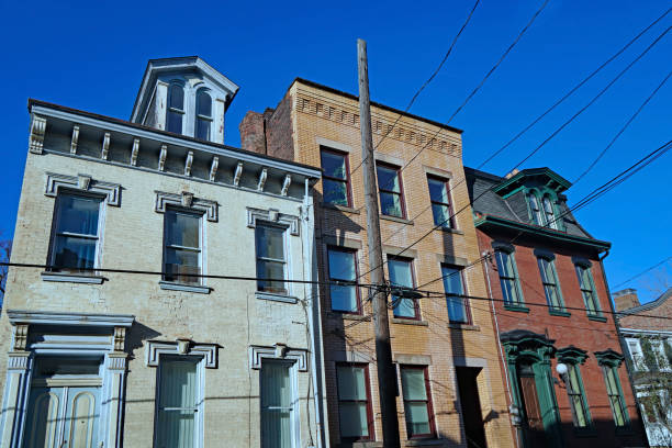 istock Old urban brick houses with overhead wires 1209301621