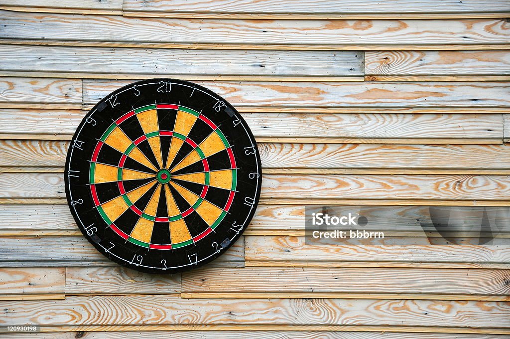 dart board dart board on wooden wall Accuracy Stock Photo