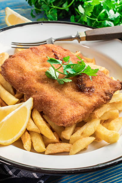 istock A piece of fried cod with fries on a plate. 1209303465
