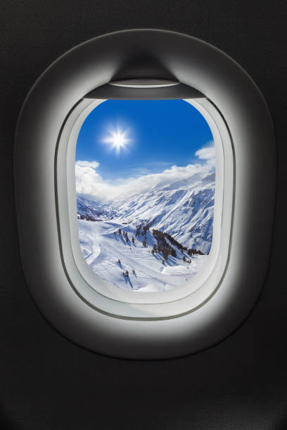 Mountains Alps at Austria in airplane window - travel background