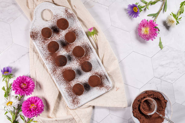 istock Fine chocolate truffles on white ceramic plate. 1209310008