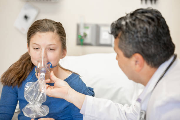 istock Young female patient gets help with asthma at pediatrician office 1209310710