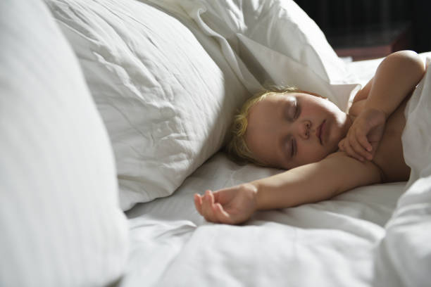 istock Baby sleeps in bed. 1209312062