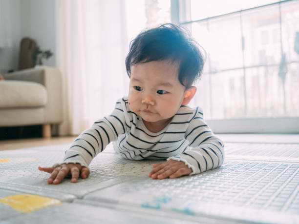 istock Little baby crawling, close-up 1209313261