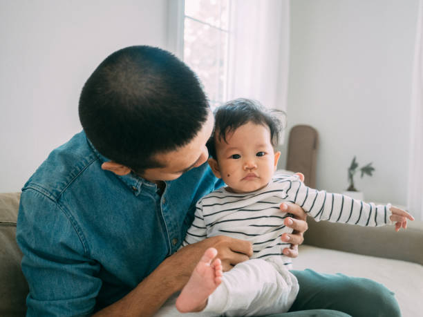 istock Happy father bonding with his little son at home 1209313308