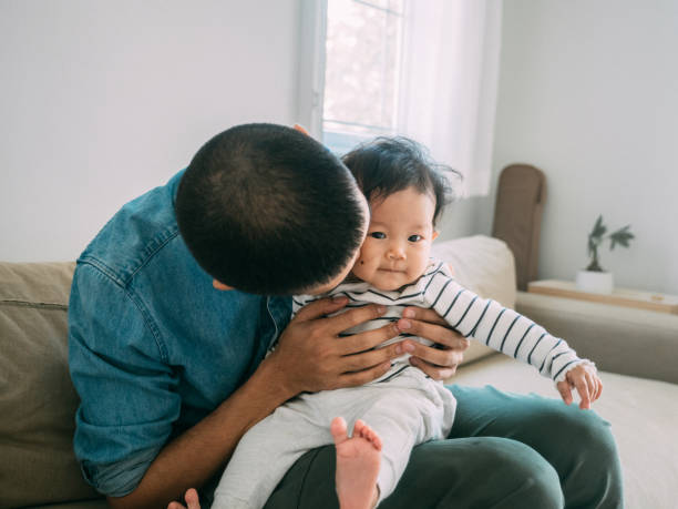 istock Happy father bonding with his little son at home 1209313327