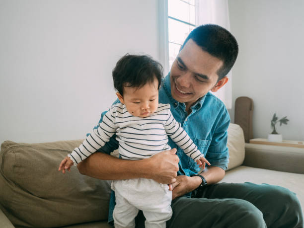 istock Father and baby at home 1209313349