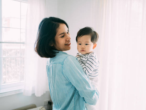 istock Mother and baby at home 1209313394