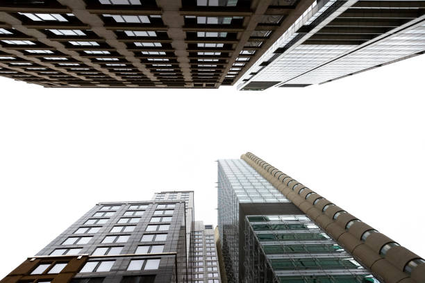 istock Low angle view of modern office buildings, skyscrapers, white background with copy space 1209316837