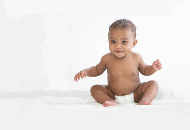istock Baby in white background wearing diaper 1209317928
