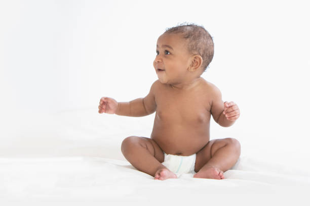 istock Baby in white background wearing diaper 1209317931