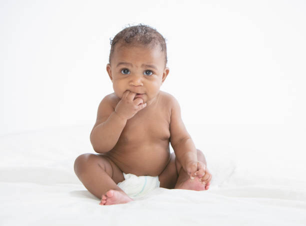 istock Baby in white background wearing diaper 1209317933