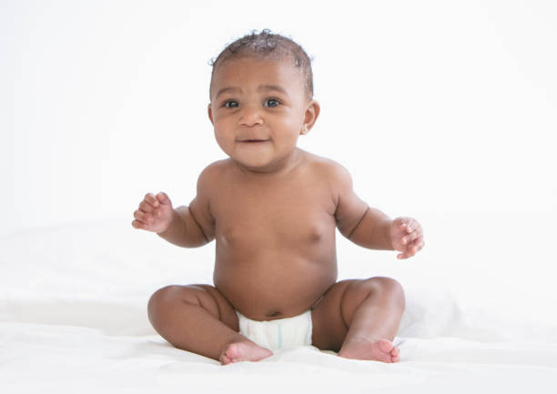 istock Baby in white background wearing diaper 1209317940
