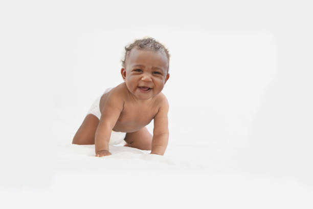 istock Baby in white background wearing diaper 1209317959