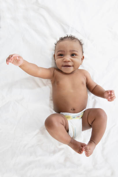 istock Baby in white background wearing diaper 1209317988