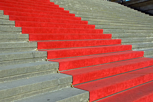 istock Red carpet leading up the stairs 120932010