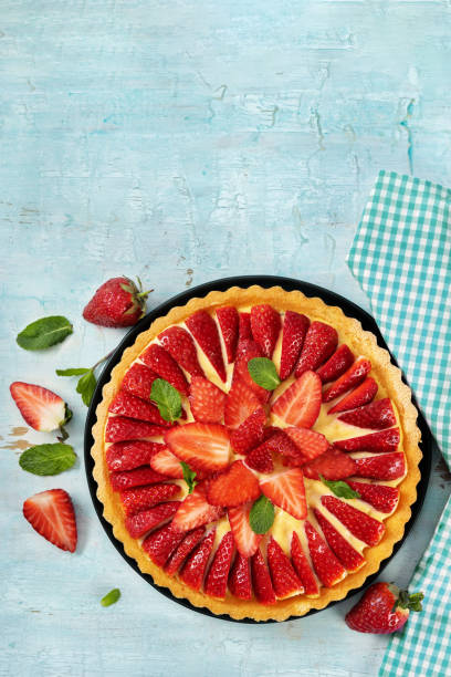 istock Top view of strawberry cake on light mint background 1209321346
