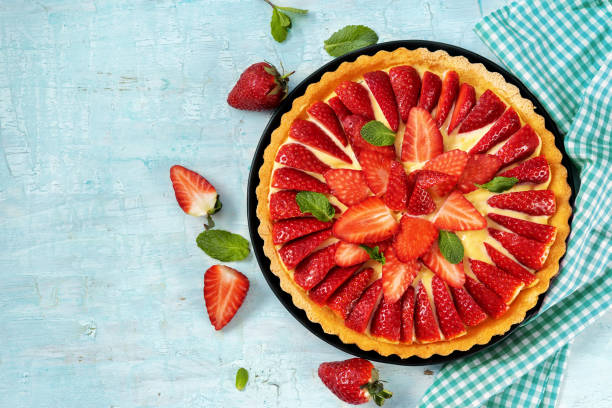 istock Top view of strawberry cake on light mint background 1209321359