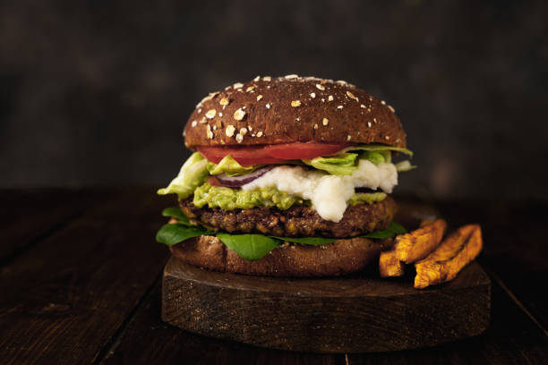 istock Vegan food. Delicious lentils burger on dark rustic background 1209324219