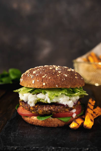 istock Delicious fresh home made vegan lentils burger on a rustic dark background 1209324250