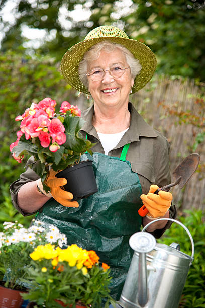 istock Smiling senior woman gardening 120932460