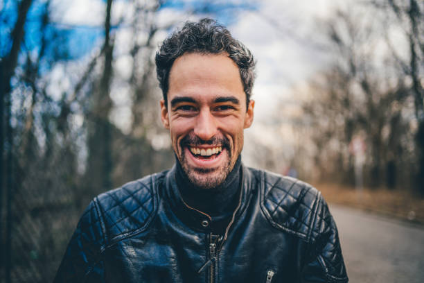 istock Portrait of happy smiling man 1209327938