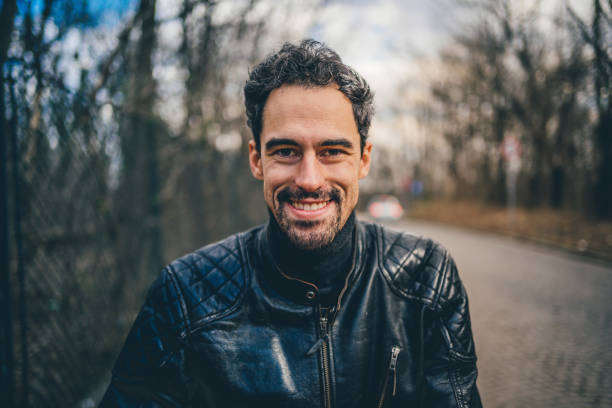 istock Portrait of happy smiling man 1209329331