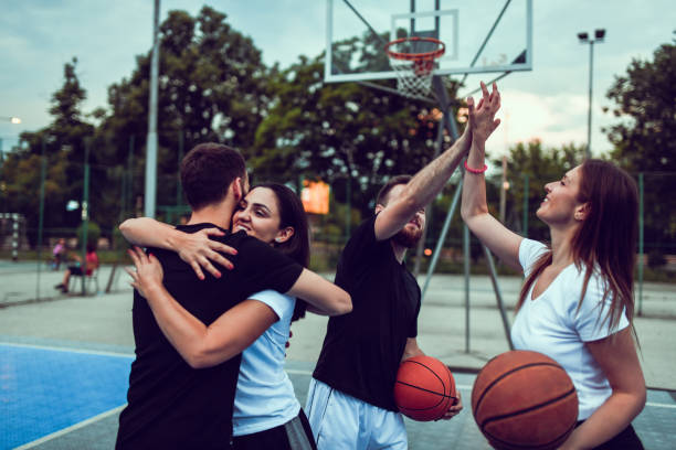 istock Friends Greeting Each Other After A Friendly Basketball Match 1209330337