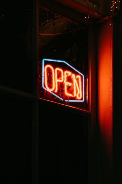 istock Red open neon sign glowing in the night. 1209332133