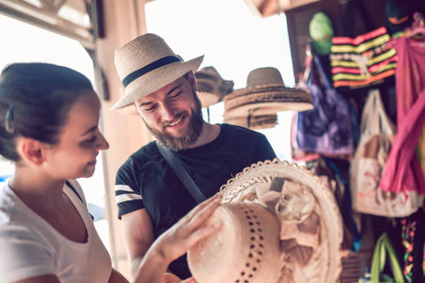 Female Buying Hats From Local Store Female Buying Hats From Local Store cuba market stock pictures, royalty-free photos & images