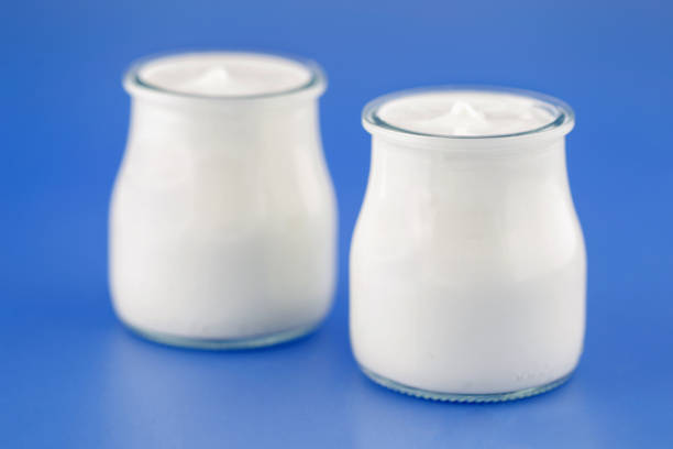 istock Tubs of natural yogurt, derived from cow's milk. 1209332605