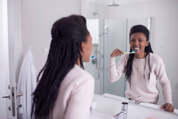 istock Woman brushing her teeth in the shower room. 1209332705