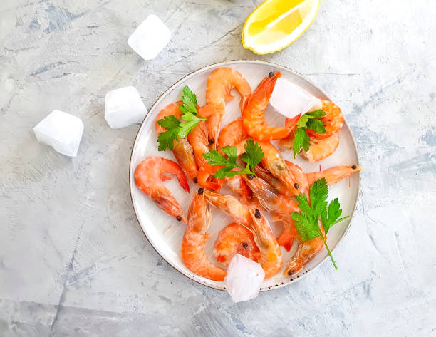 istock fresh shrimp in a plate on concrete background 1209334586
