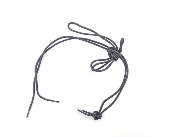 istock Shoelaces with a knot on a white background. 1209336316