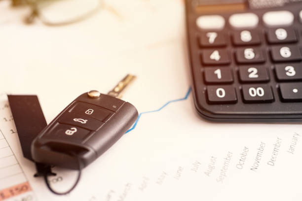 istock car sales chart concept visual. car keys, graphics and calculator 1209337304
