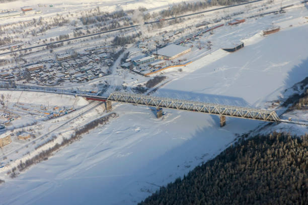 istock Railway bridge over the Lena river in winter from a plane 1209337460