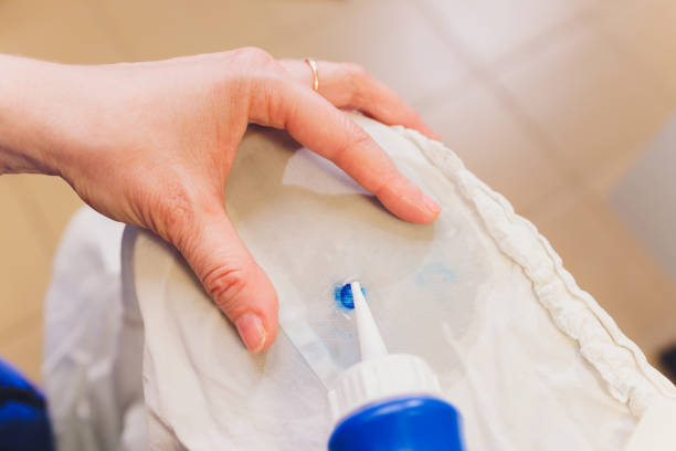 istock Hand Laundry worker in the process of removing stains by using a special dry-cleaning. 1209341337