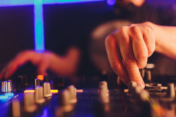 istock DJ in the club for the remote mixer. 1209342014
