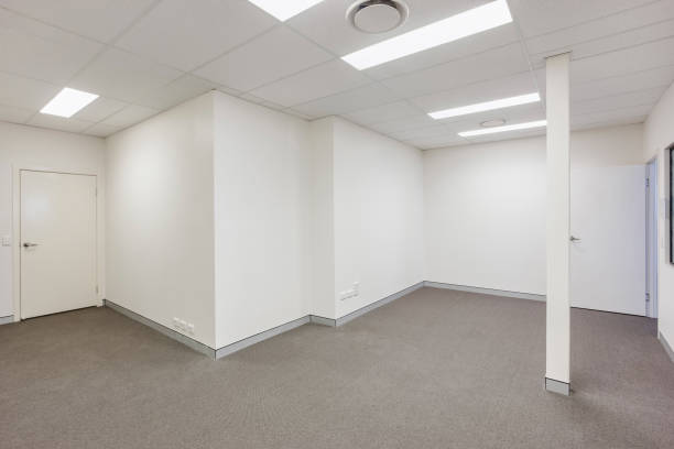 istock Empty room with a closed door and pillar 1209344863