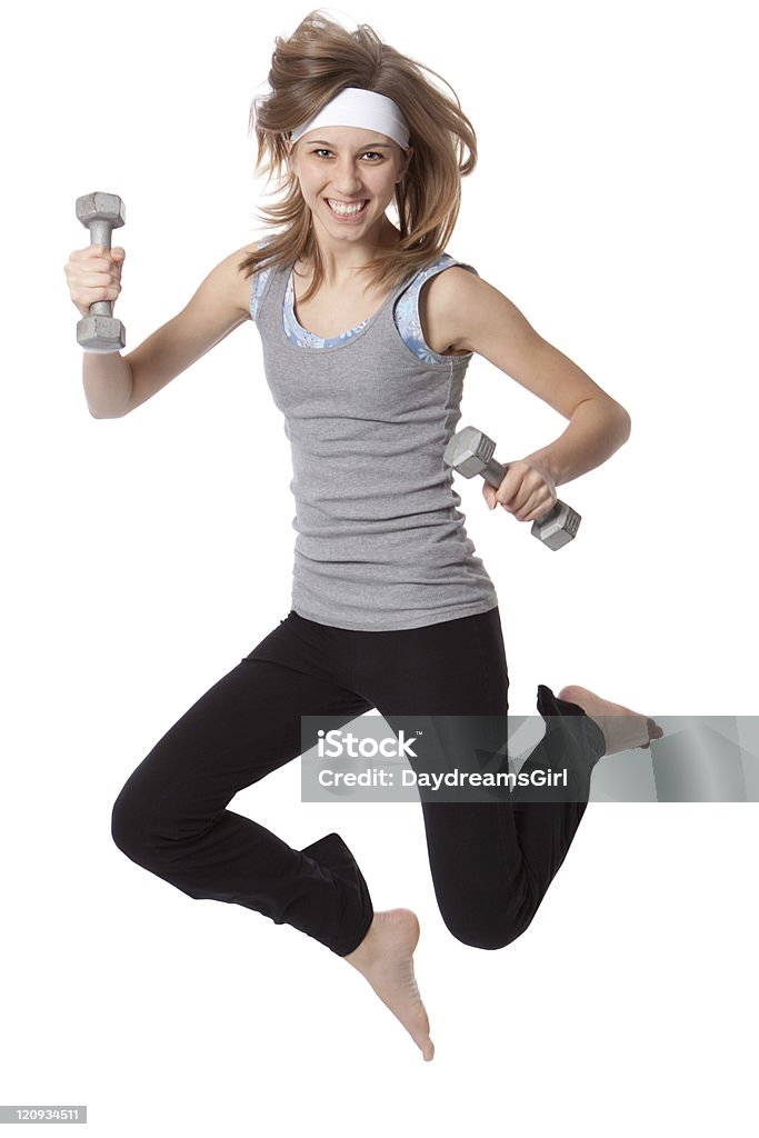 Esercizio giovane donna con pesi saltando isolato su bianco - Foto stock royalty-free di 18-19 anni
