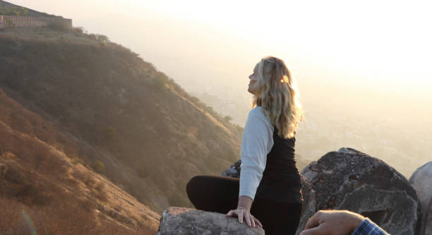 istock Mature couple look off from castle wall at sunrise 1209345733