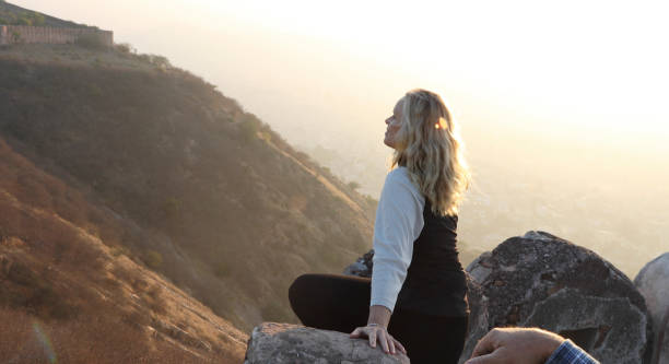 istock Mature couple look off from castle wall at sunrise 1209345751
